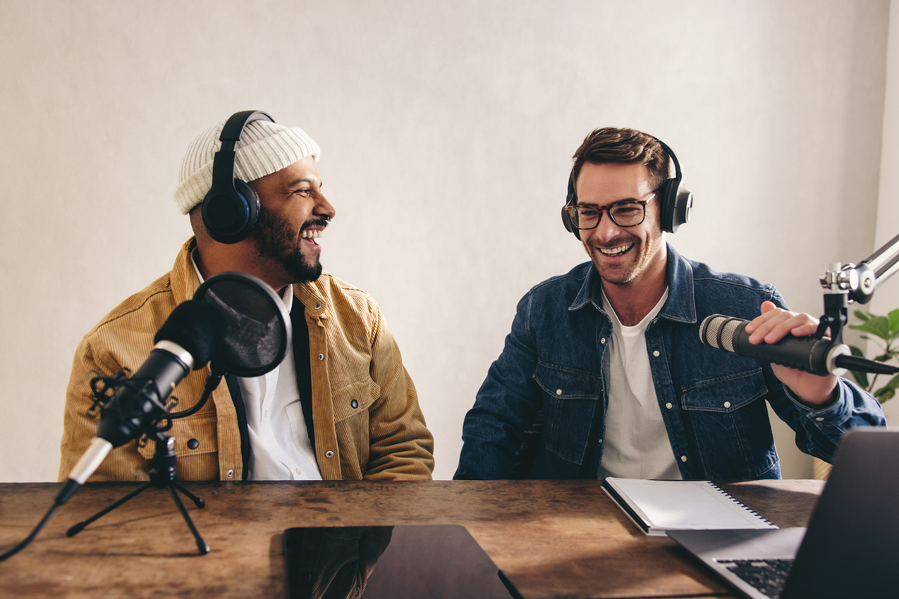 Two men in studio discuss wellbeing together